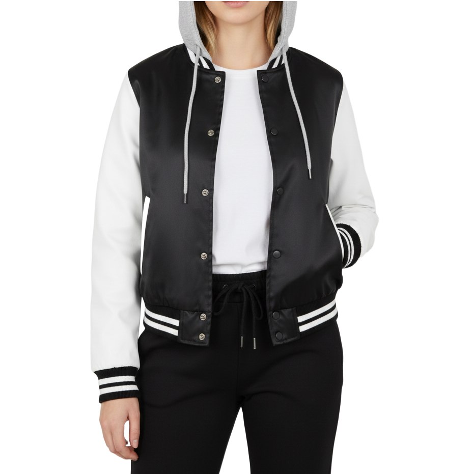Black and white varsity jacket worn by a woman on a white background