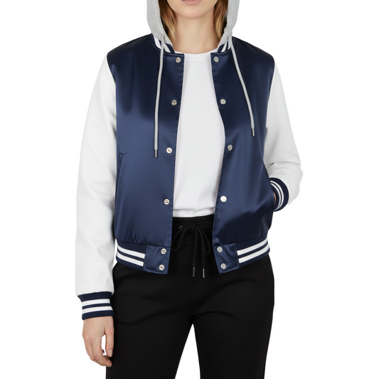 Navy and white varsity jacket worn by a woman on a white background